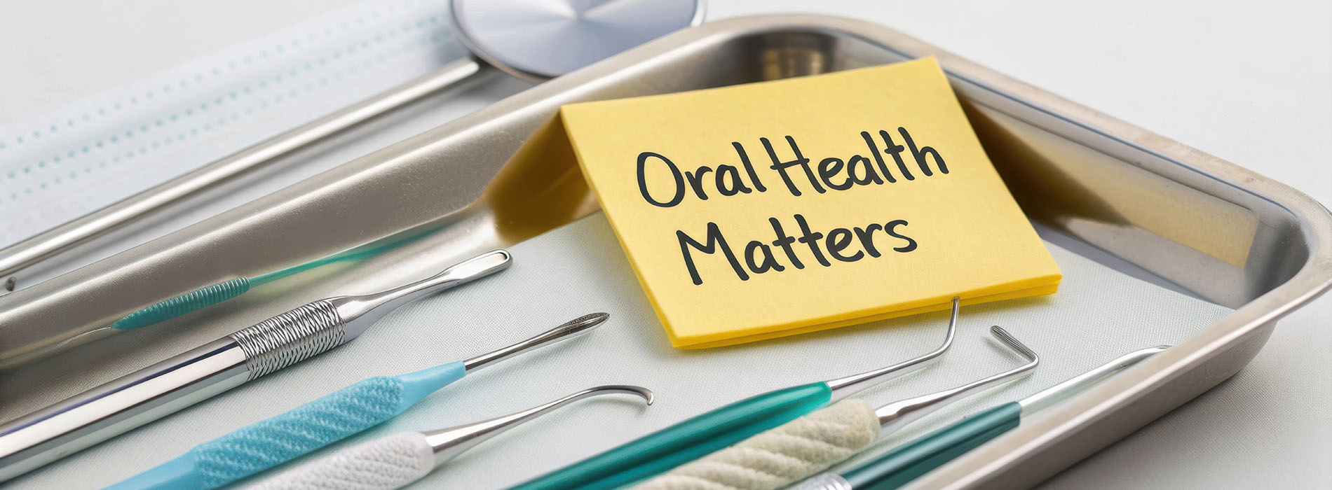 The image shows a metal tray with various dental instruments, including scissors, forceps, and tweezers, and a yellow sticky note with the words  dental matters  written on it.